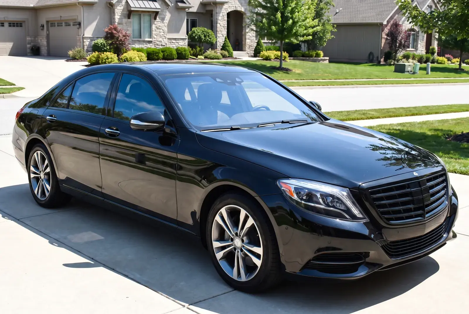 Same sedan with trim blacked out after chrome delete